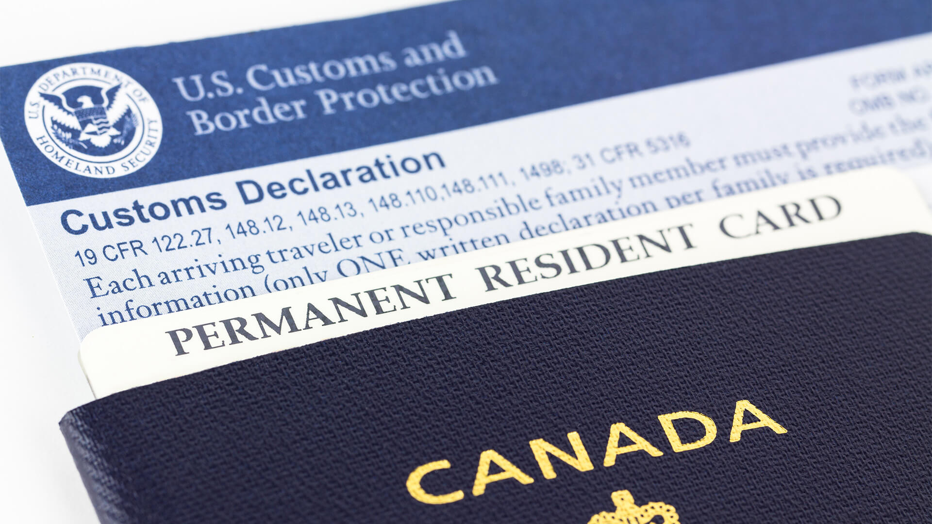 Canadian passport, permanent resident card and form.