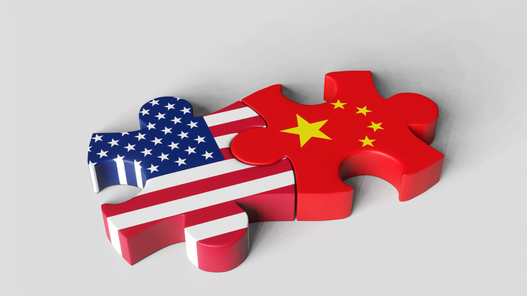 2 pieces of jigsaw puzzle representing the USA and China.